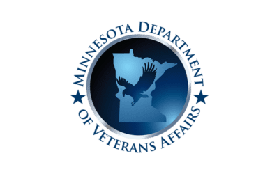 A circular logo with a silhouette of Minnesota and an eagle in flight in the center.