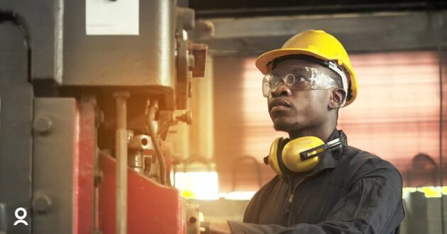 man working on machinery