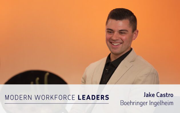 A man in a beige blazer smiles while seated in front of an orange background. Text overlay reads: "Modern Workforce Leaders, Jake Castro, Boehringer Ingelheim—insights on workforce management.